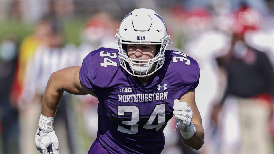 Northwestern Wildcats linebacker Xander Mueller (34) runs on the field during the second half of an NCAA football game against Rutgers Scarlet Knights on Saturday, Oct. 16, 2021, in Evanston, Ill. | Kamil Krzaczynski, Associated Press
