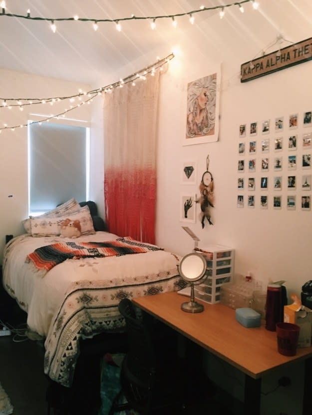 A bed with fairy lights above it