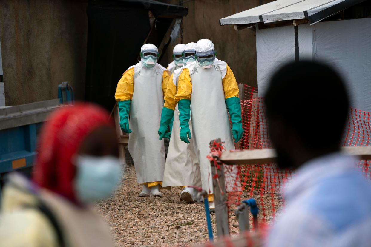 Health workers dressed in protective gear begin their shift at an Ebola treatment center in Beni, Democratic Republic of Congo.