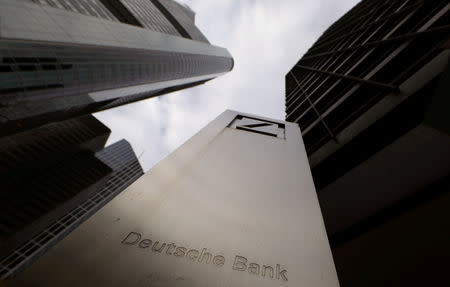 FILE PHOTO: The logo of Deutsche Bank is seen in front of one of the bank's office buildings in Frankfurt, Germany, October 27, 2016. REUTERS/Kai Pfaffenbach/File Photo