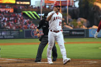 Los Angeles Angels' Mike Trout gestures as he scores after hitting a solo home run during the fourth inning of a baseball game Los Angeles Angels Friday, June 24, 2022, in Anaheim, Calif. (AP Photo/Mark J. Terrill)