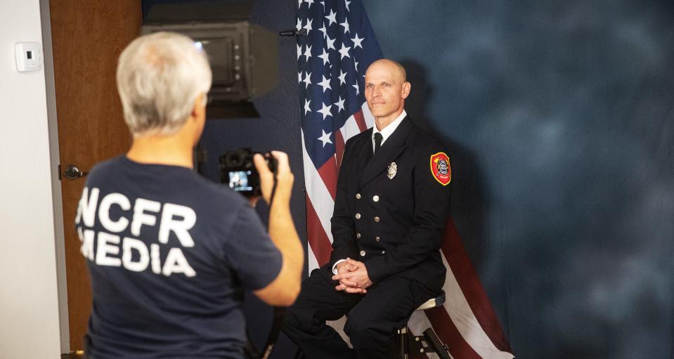 David Perez, an Engineer/Paramedic for the North Collier Fire Department has his portrait taken at the headquarters in Naples on Tuesday, March 12, 2024. Since 2020, Perez has been diagnosed with two forms of cancer, multiple myeloma and mantle cell lymphoma. The diagnoses are on the list cancers that are associated with being a firefighter according a bill that Gov. Ron DeSantis signed into law in 2019. He became in cancer free in Sept. 2023. He attributes his recovery with a healthy mindset, a strict exercise regime, a healthy diet and the use of a sauna along with traditional cancer treatments. He is currently not actively fighting fires, but is educating colleagues on cancer safety.