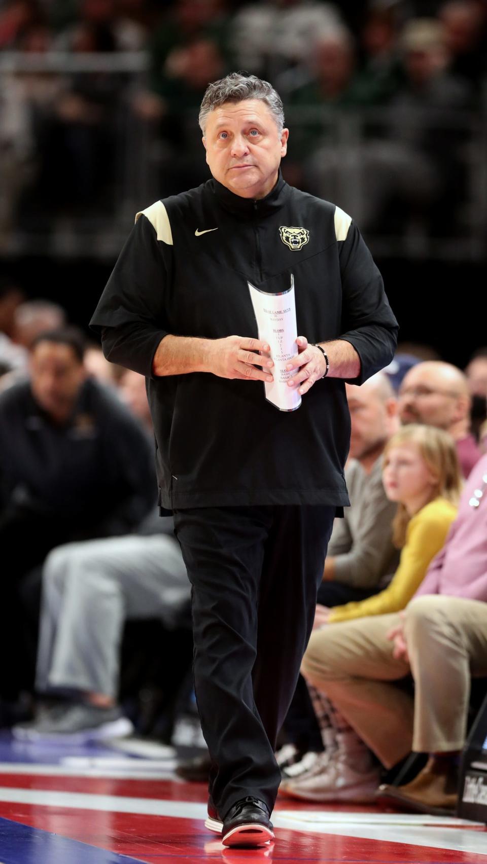 Oakland coach Greg Kampe watches during the second half of MSU's 90-78 win on Tuesday, Dec. 21, 2021, at Little Caesars Arena.