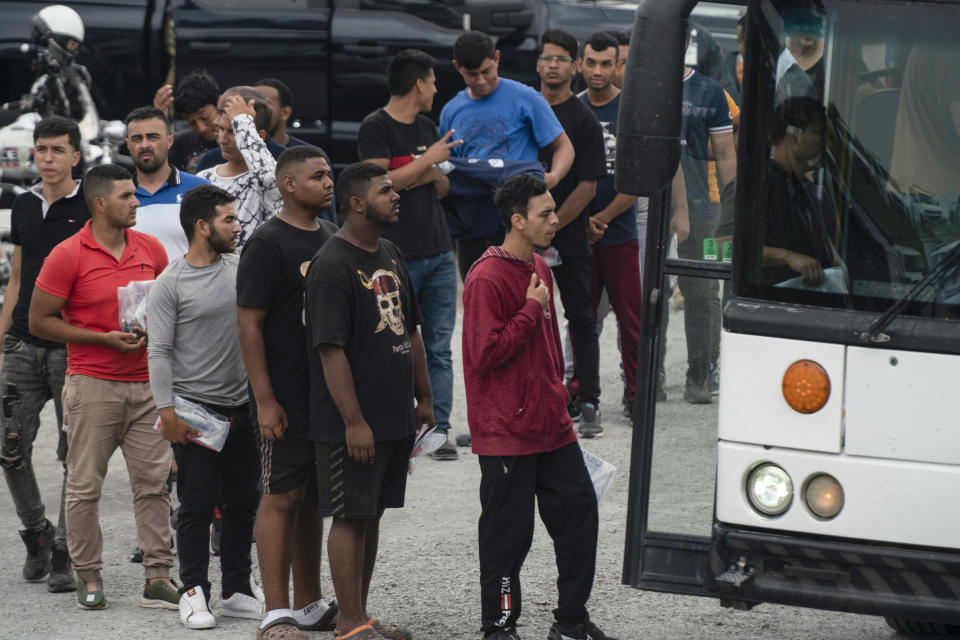 Migrants who recently crossed the border between the U.S. and Mexico are seen in Brownsville, Texas, Friday, May 5, 2023. (AP Photo/Veronica G. Cardenas)