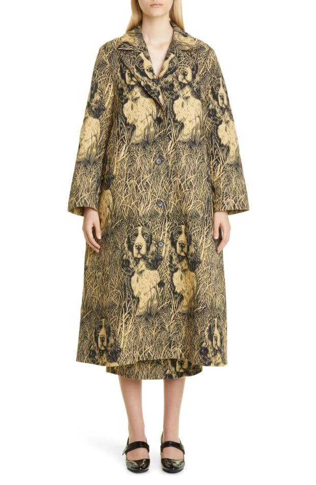 <em>Puppets and Puppets </em><em>Puppy Jacquard Single Breasted Belted Overcoat, $777 (from $1,295), <a href="https://rstyle.me/+8ct_QJHg1Dfu2qU6qHDtKA" rel="nofollow noopener" target="_blank" data-ylk="slk:available here;elm:context_link;itc:0;sec:content-canvas" class="link ">available here</a> (sizes 6 and 8), and</em> Puppy Jacquard Pencil Skirt, $417 (from $695), <a href="https://rstyle.me/+eq0SC74cTkWrjFZWLs0bVg" rel="nofollow noopener" target="_blank" data-ylk="slk:available here;elm:context_link;itc:0;sec:content-canvas" class="link ">available here</a> (sizes 2 and 6)