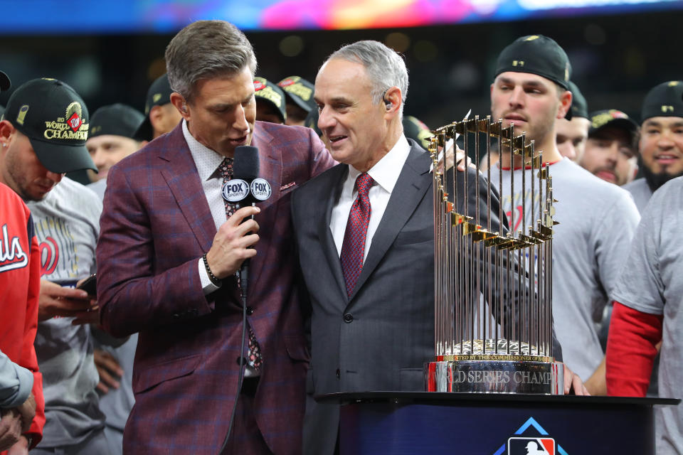 HOUSTON, TX - OCTOBER 30: Major League Baseball Commissioner Robert D. Manfred Jr. talks with Fox Sports commentator Chris fowler during the World Series trophy presentation after the Nationals defeat the Houston Astros in Game 7 to win the 2019 World Series at Minute Maid Park on Wednesday, October 30, 2019 in Houston, Texas. (Photo by Alex Trautwig/MLB Photos via Getty Images)