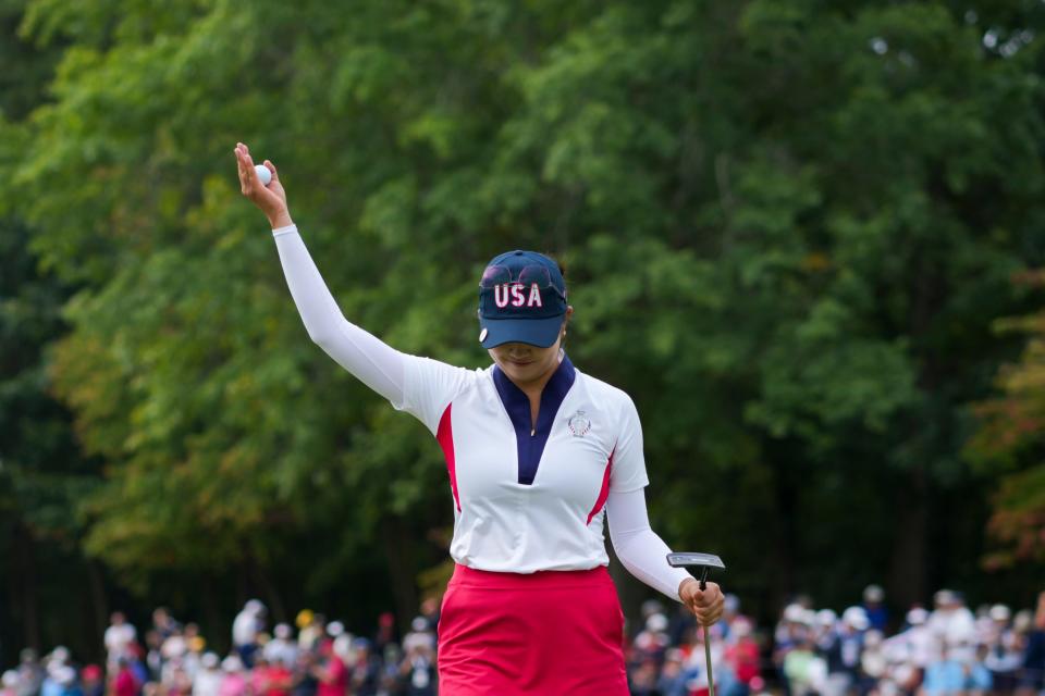 Rose Zhang of Team USA reacts after her putt on the second green during single matches against Team Europe during the Solheim Cup 2024 at Robert Trent Jones Golf Club. Mandatory Credit: Aaron Doster-Imagn Images