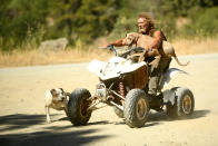 <p>Ponderosa fire evacuee Lynn, who declined to give a last name, rides with his dog Bugs Buggy while watching the fire burn east of Oroville, Calif., Aug. 30, 2017. (Photo: Noah Berger/Reuters) </p>