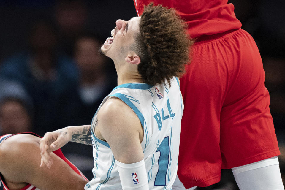 Charlotte Hornets guard LaMelo Ball is shaken up on a play in the second half of an NBA preseason basketball game against the Washington Wizards in Charlotte, N.C., Monday, Oct. 10, 2022. (AP Photo/Jacob Kupferman)