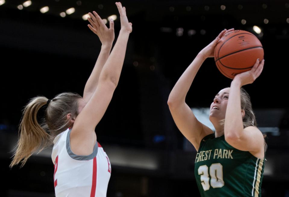 Forest Park's Lydia Betz (30) jumps up for a shot around Frankton's Bella Dean (12) during the IHSAA girls basketball Class 2A state championship at Gainbridge Fieldhouse in Indianapolis, Ind., Saturday afternoon, Feb. 26, 2022.