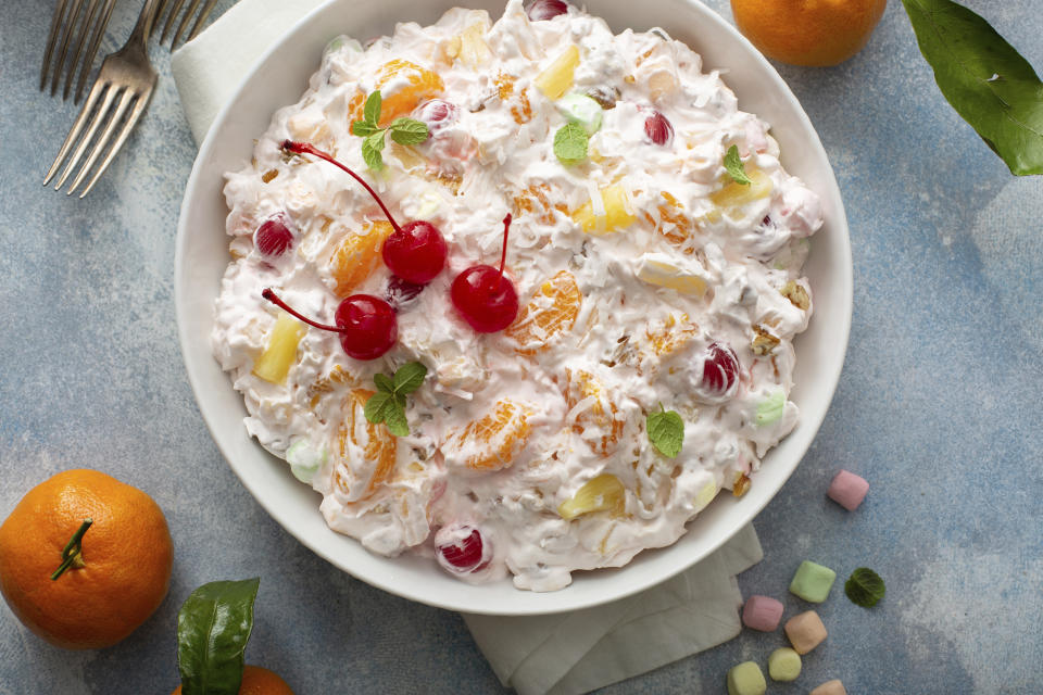 This December 2020 photo shows a recipe for Ambrosia salad for the food blog My Baking Addiction in Suwanee, Ga. The fluffy fruit concoction has a history dating back more than 100 years. (Elena Vaselova for My Baking Addiction via AP).