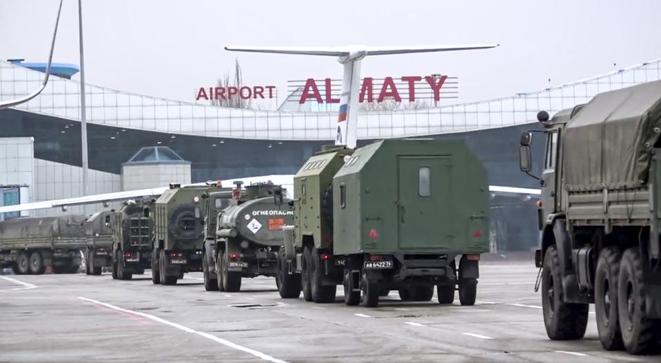 FILE - In this handout photo released by Russian Defense Ministry Press Service, vehicles of Russian peacekeepers leave an airport of Almaty, Kazakhstan, Sunday, Jan. 9, 2022. At Tokayev's request, 2,000 peacekeepers from the Moscow-led CSTO security alliance were deployed to Kazakhstan, leading to speculation about possible direct intervention by the Kremlin. These fears did not come to pass, with the CSTO announcing in late January that its troops had pulled out without firing a single shot. (Russian Defense Ministry Press Service via AP, File)