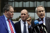 British cave explorer Vernon Unsworth, center, with his attorneys, Mark Stephens, left, and L. Lin Wood, right, take questions from the media outside Los Angeles U.S. District Court Friday, Dec. 6, 2019. A Los Angeles jury has found Elon Musk did not defame Unsworth when he called him "pedo guy" in an angry tweet. Musk said the attack was unprovoked and he only meant the term as an insult for "creepy old man" and wasn't literally calling Unsworth a pedophile. (AP Photo/Damian Dovarganes)