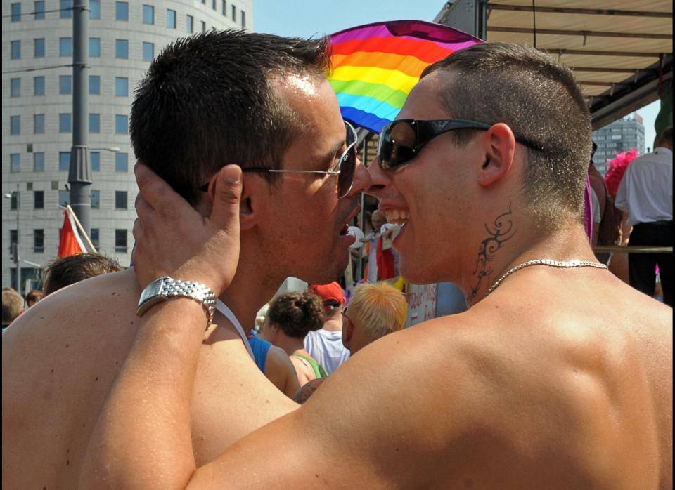 Participants kiss as they march during the 2010 Euro Pride gay parade in Warsaw, Poland. 