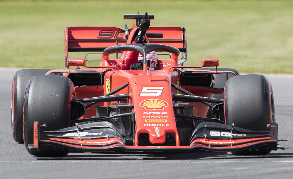 Ferrari driver Sebastian Vettel of Germany gestures after winning pole position during qualifying for the Formula One Canadian Grand Prix auto race in Montreal, Saturday, June 8, 2019. (Graham Hughes/The Canadian Press via AP)