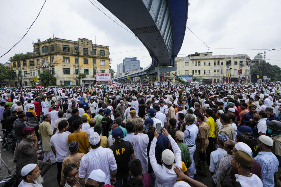 Indian Muslims block road as they protest against the spokesperson of governing Hindu nationalist party as they react to the derogatory references to Islam and the Prophet Muhammad in Kolkata, India, Friday, June 10, 2022. Thousands of Muslims emerging from mosques after Friday prayers held street protests and hurled rocks at the police in some Indian towns and cities over remarks by two officials from India’s ruling party that were derogatory to the Prophet Muhammad. (AP Photo/Bikas Das)