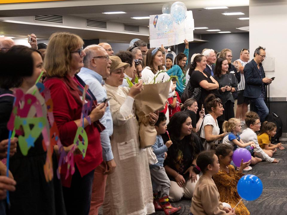 Families wait to be reunited as travellers arrive on the first flight from Sydney, in Wellington on April 19, 2021, as Australia and New Zealand opened a trans-Tasman quarantine-free travel bubble. (Photo by Marty MELVILLE / AFP) (Photo by MARTY MELVILLE/AFP via Getty Images)