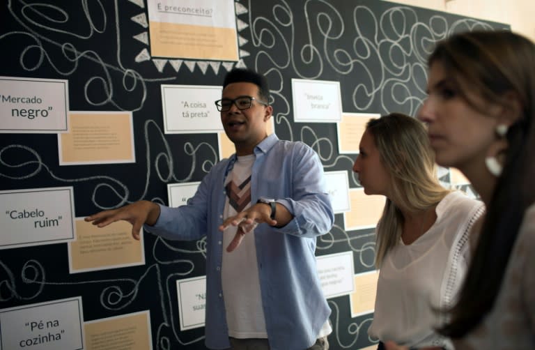 Esteban Cipriano, in charge of education programs at the anti-racism group ID_BR, talks to employees of the fashion brand Maria Filo in Rio de Janeiro, Brazil, on November 17, 2017