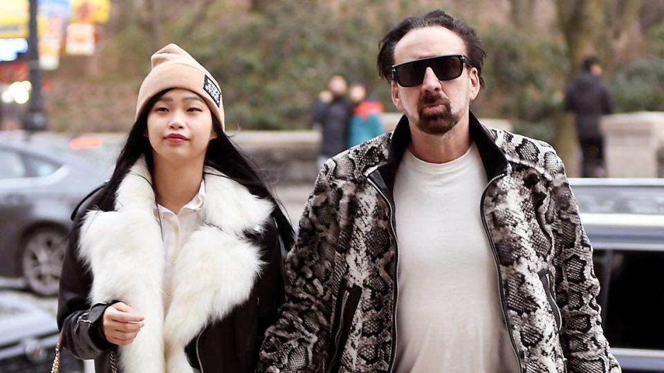 Nicolas Cage and his girlfriend Riko Shibata matching black leather pants while going insid THE American Museum of Natural History