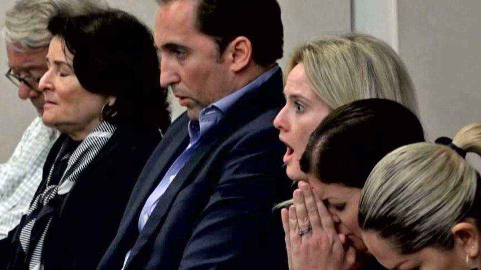 Caroline Reuschel reacts when hearing her father's guilty verdict. / Credit: CBS News