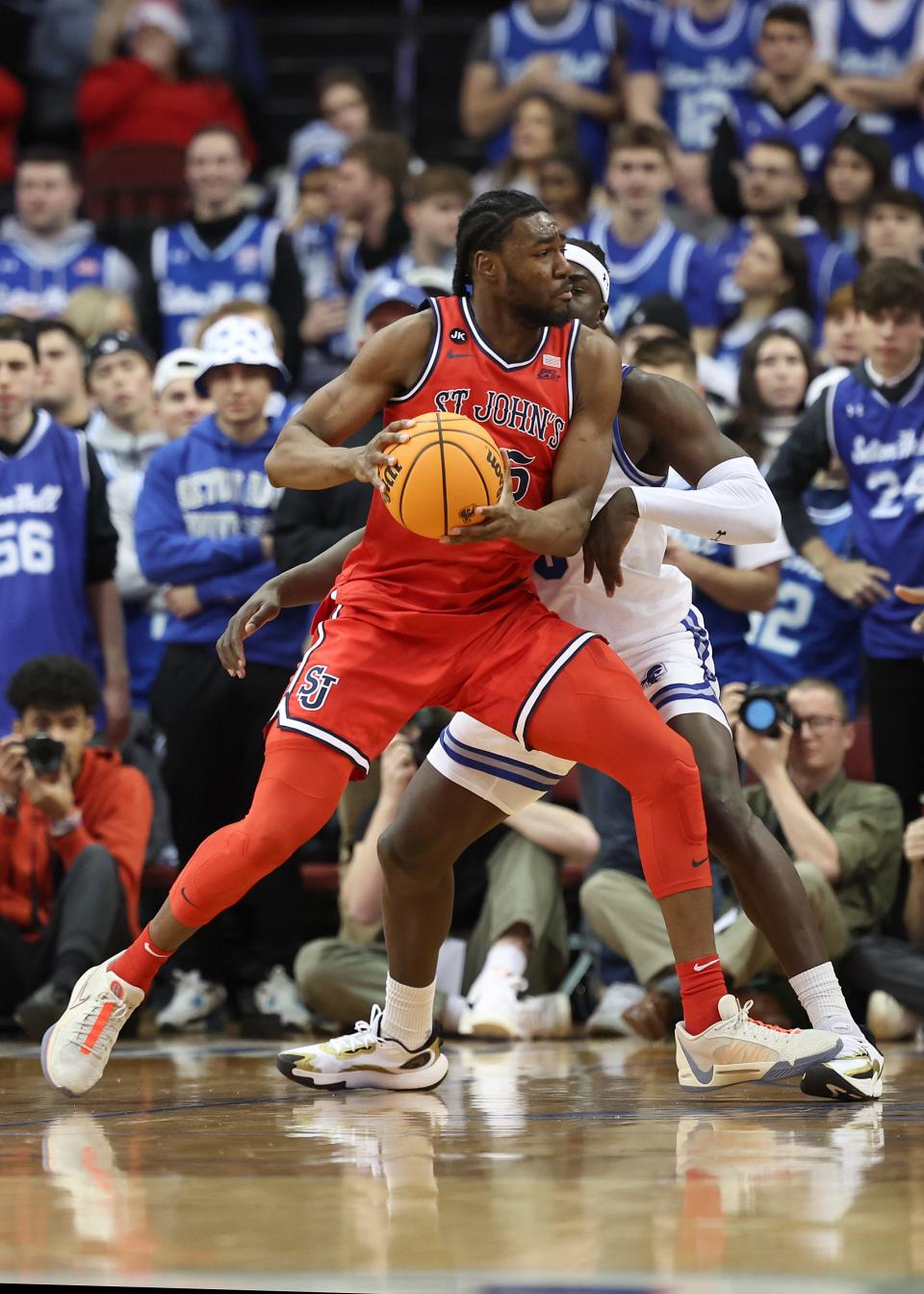 St. John's forward Drissa Traore (55) drives to the basket against a Seton Hall player during a game last season. On Monday, Traore committed to URI.