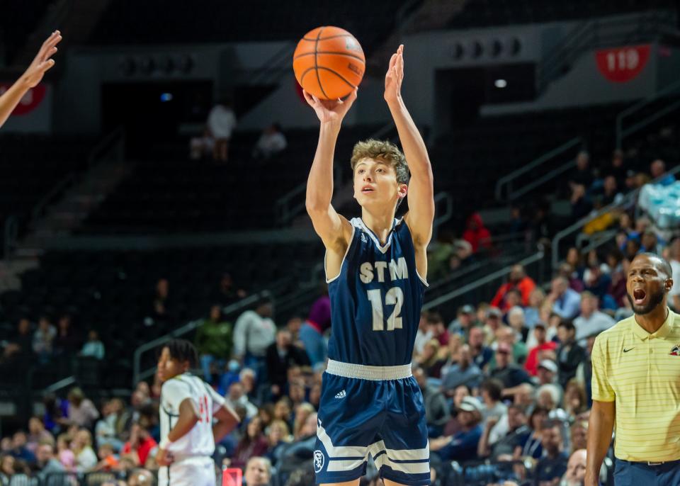 Michael Mouton takes a shot as St Thomas More takes on Liberty Magnet in the LHSAA State playoffs in the Cajundome. Wednesday, March 2, 2022.