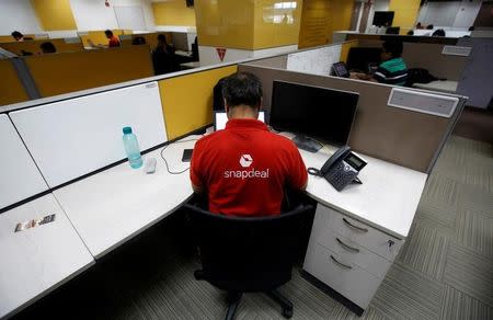 Employees work inside Snapdeal headquarters in Gurugram on the outskirts of New Delhi, April 3, 2017. REUTERS/Adnan Abidi