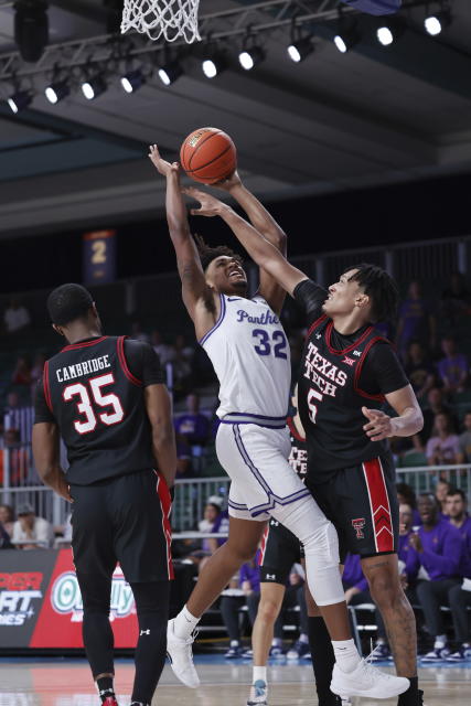 In a photo provided by Bahamas Visual Services, Texas Tech's Darrion Williams blocks Northern Iowa's Tytan Anderson during the second half of an an NCAA college basketball game in the Battle 4 Atlantis at Paradise Island, Bahamas, Thursday, Nov. 23, 2023. (Tim Aylen/Bahamas Visual Services via AP)