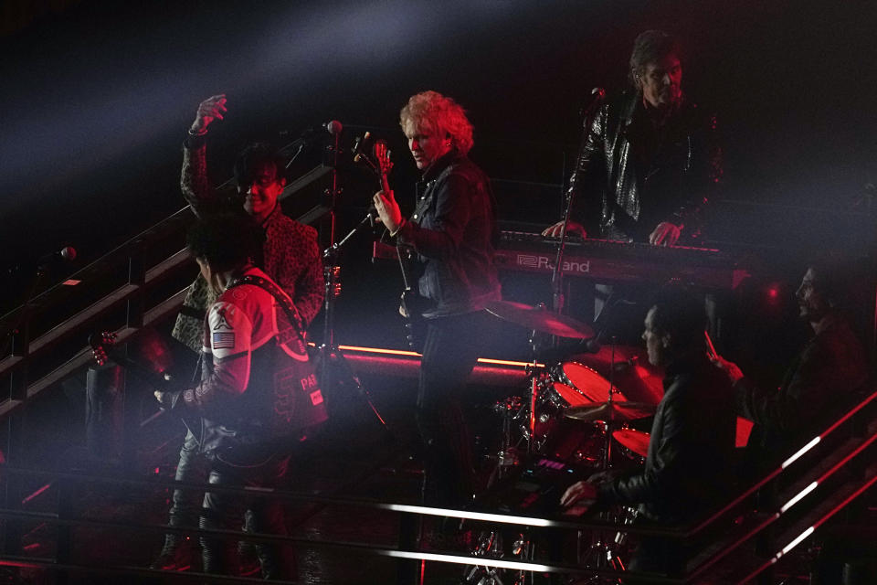 Journey performs during an opening ceremony for the Formula One Las Vegas Grand Prix auto race, Wednesday, Nov. 15, 2023, in Las Vegas. (AP Photo/Darron Cummings)