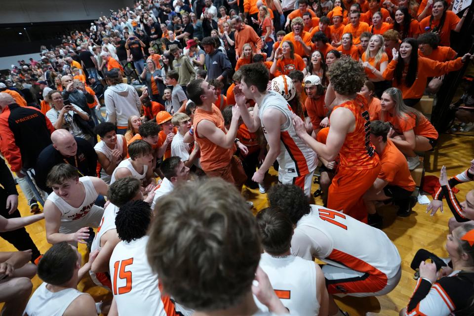 Delaware Hayes players and students celebrate a 56-40 win over Hilliard Bradley in a boys basketball regional semifinal Wednesday at Ohio Dominican.