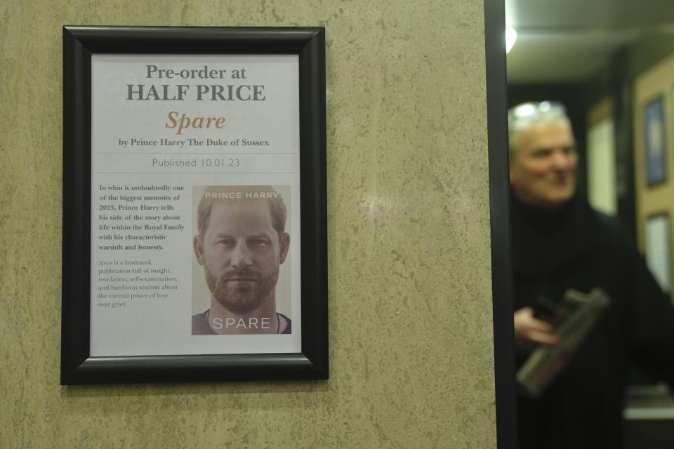 A promotional poster of the new book "Spare"is displayed in a bookstore in London, Thursday, Jan. 5, 2023. Prince Harry alleges in a much-anticipated new memoir that his brother Prince William lashed out and physically attacked him during a furious argument over the brothers' deteriorating relationship, The Guardian reported Thursday. The newspaper said it obtained an advance copy of the book, "Spare," due to be published next week. (AP Photo/Kin Cheung)