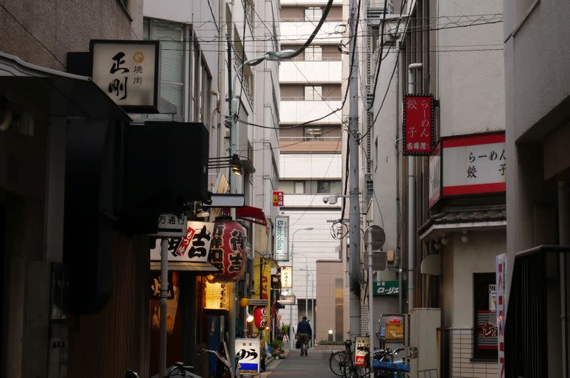 Eateries stand on a street near the Tokyo Stock Exchange building at Kayabacho district in Tokyo
