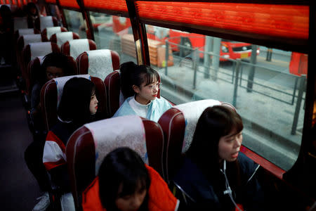 Nao Niitsu, 19, college freshman from Tokyo, who wants to be a K-pop star, and other Japanese children sit on a bus heading for an audition in Seoul, South Korea, March 15, 2019. REUTERS/Kim Hong-Ji