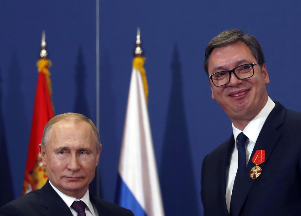 FILE - In this photo taken Thursday, Jan. 17, 2019, Russian President Vladimir Putin, left, poses with Serbian President Aleksandar Vucic after being awarded the Order of Alexander Nevsky in Belgrade, Serbia. Serbia is seeking an increased Russian role in the European Union-mediated talks with the former province of Kosovo, the move which could further strain the Balkan country's relations with the West. Serbia's Foreign Minister Ivica Dacic said after meeting his Russian counterpart Sergey Lavrov on Wednesday, April 17 in Moscow that "Serbia cannot defend its state interests without the assistance of the Russian Federation." (AP Photo/Darko Vojinovic)