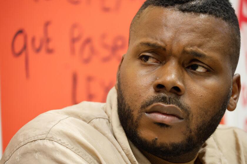 Michael Tubbs, former mayor of Stockton and now Gov. Gavin Newsom's 'economic mobility' advisor listens to a fast food worker cut by a customer who broke a COVID shield at an SEIU meeting on Monday, Oct. 17, 2022, in Oakland, Calif.