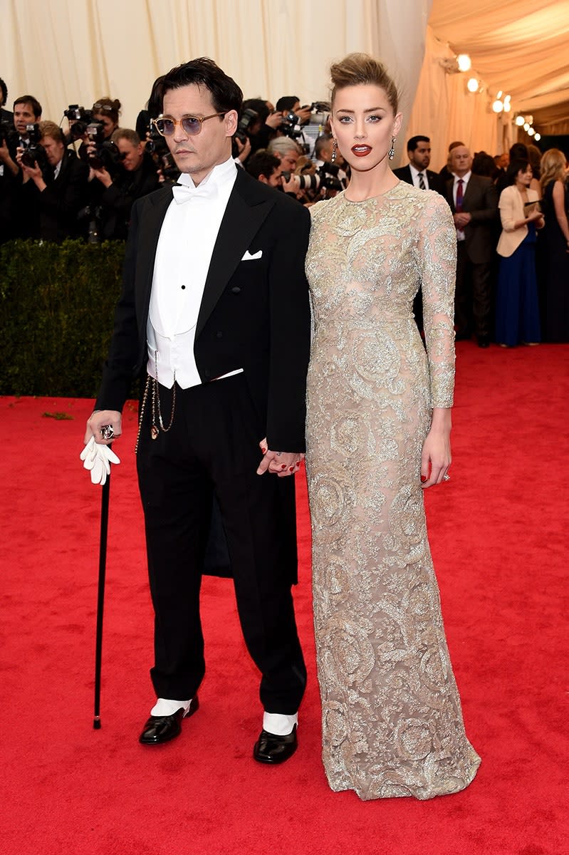 <h1 class="title">Johnny Depp in Ralph Lauren Black Label and Amber Heard in a Giambattista Valli Haute Couture dress and Fred Leighton jewelry</h1><cite class="credit">Photo: Getty Images</cite>