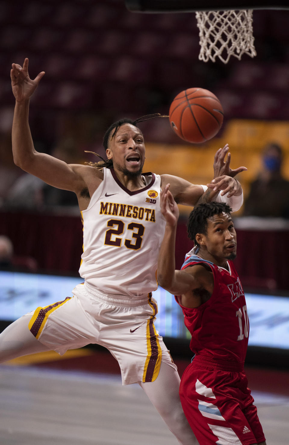 Minnesota forward Brandon Johnson (23) cannot grab a long pass under the net as he is guarded by Loyola Marymount guard Quentin Jackson Jr. (10) in the first half of an NCAA college basketball game Monday, Nov. 30, 2020, in Minneapolis. (Jeff Wheeler/Star Tribune via AP)