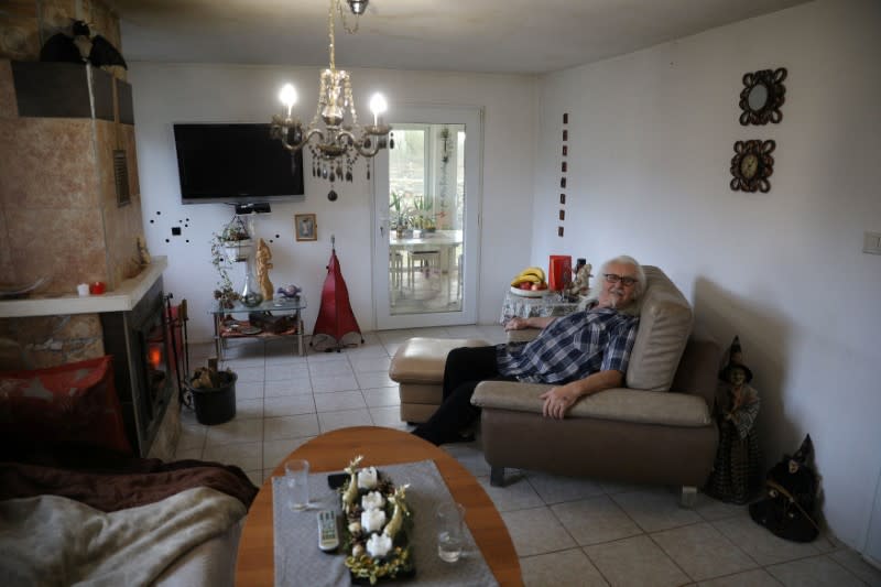 Waldemar Hackstaetter is pictured inside his house in the village of Sirakovo