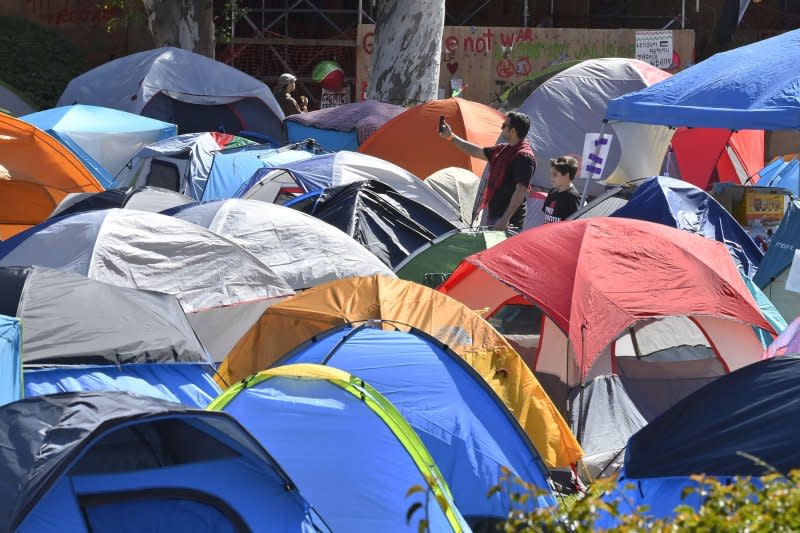 A pro-Palestinian encampment is seen Sunday cordoned off by stanchions on UCLA's campus. Scuffles broke out Sunday between the pro-Palestinian protesters and pro-Israel protesters who held a rally nearby, as additional security was brought in to keep the groups separated. Photo by Jim Ruymen/UPI