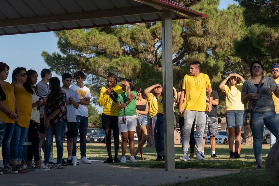 9/2/19 5:19:43 PM -- Odessa, tx, U.S.A  --   High school students from Odessa meet for a prayer vigil at Sherwood Park trying to do fun-raising for the victims of the recent shootings. The death toll rose to seven after a gunman's rampage that left many more injured following what began as a routine traffic stop in Odessa.  Photo by Nick Oza/ Gannett ORG XMIT:  NO 138232 Odessa shooting 9/2/2019 (Via OlyDrop)