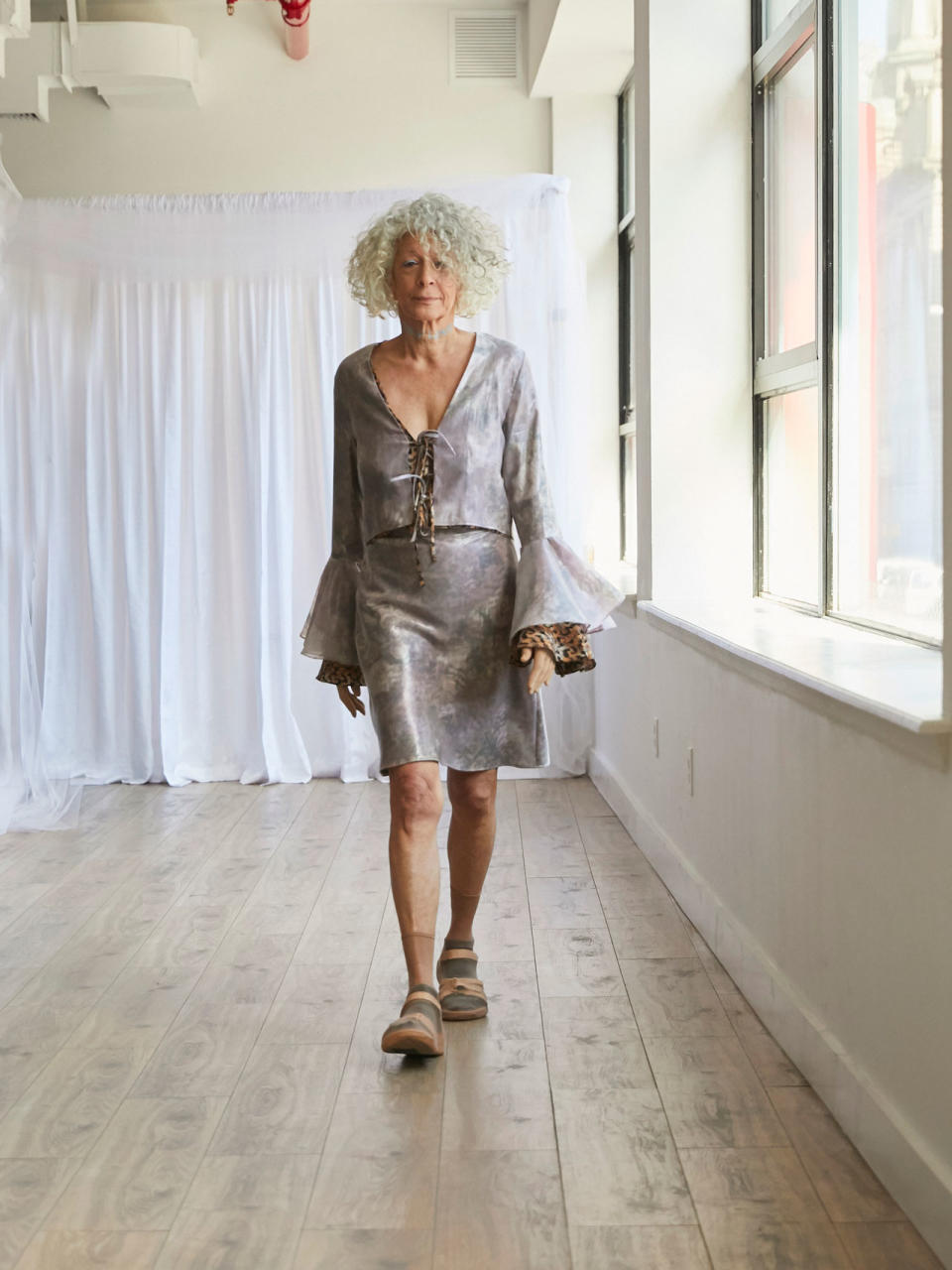 <p>Older female model wears a bell sleeve dress at the Collina Strada Fall/Winter 2018 show. (Photo: Jonathan Hokklo) </p>