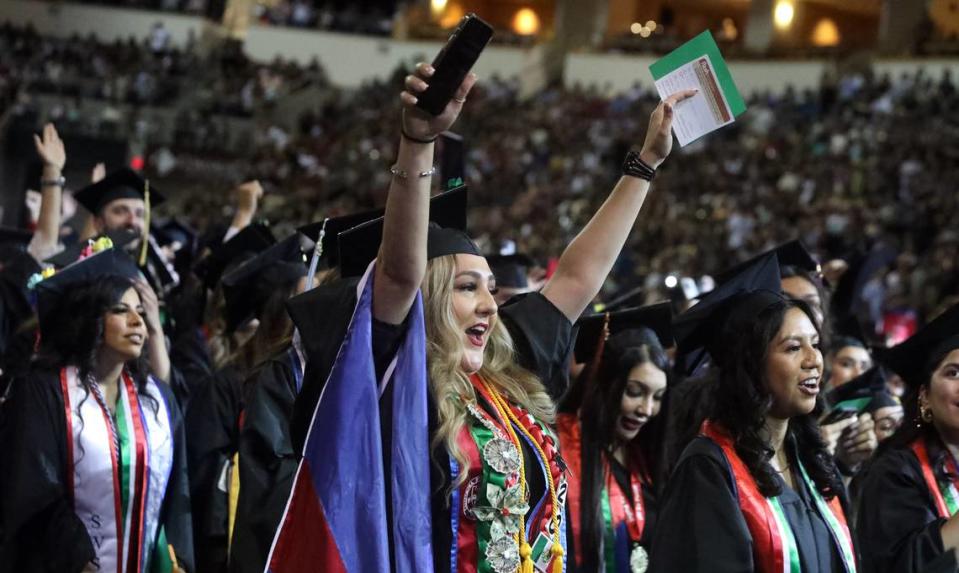 Noemi López, an Orosi resident who earned a master’s degree in education, celebrates during the 47th Chicano/Latino Commencement Celebration at the Save Mart Center on May 20, 2023.