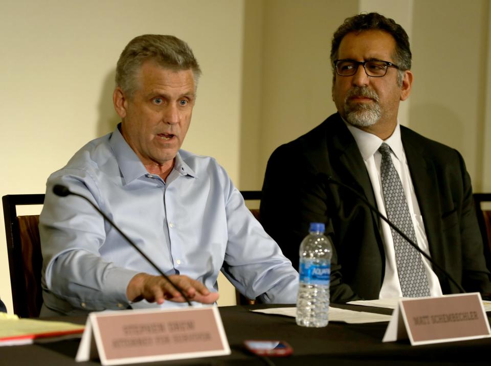 Matt Schembechler, left, and his attorney Mick Grewal talk with reporters about sexual assault allegations against Michigan doctor Robert E. Anderson on Thursday in Detroit.