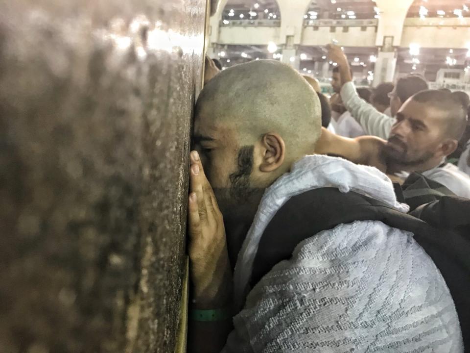 In 2018, Muslim Hajj pilgrims touch the wall of the Kaaba.