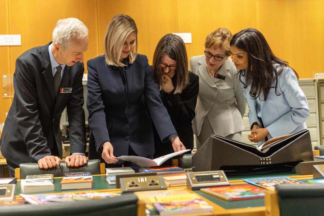Akshata Murty and Olena Zelenska look at the Ukrainian collection as they visit the British Library in central London (AP)