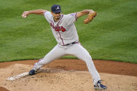 Atlanta Braves starting pitcher Charlie Morton winds up during the first inning of an interleave baseball game, Tuesday, April 20, 2021, at Yankee Stadium in New York. (AP Photo/Kathy Willens)