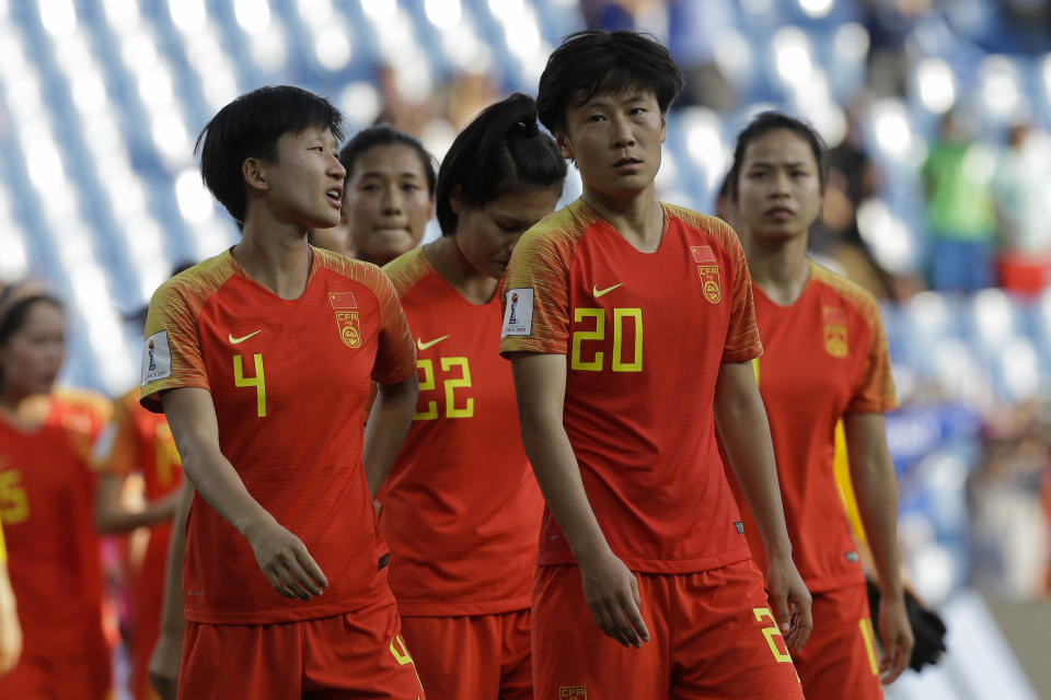 China players walk along the pitch at the end of the Women's World Cup round of 16 soccer match between Italy and China at Stade de la Mosson in Montpellier, France, Tuesday, June 25, 2019. Italy won 2-0. (AP Photo/Claude Paris)