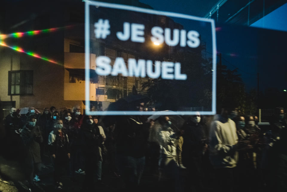 About 6,000 people gathered in front of the Bois d'Aulne College in Conflans Saint-Honorine, a suburb of Paris, on  October 20,  2020, to participate in a white march in honor of Samuel Paty, a history teacher at the college, who was beheaded in an attack on October 16 for showing caricatures of the Prophet Mohammed during a course on freedom of expression. (Photo by Samuel Boivin/NurPhoto via Getty Images)