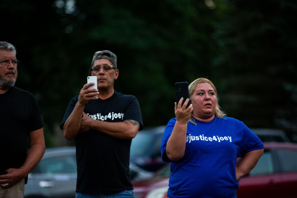 Dozens of supporters joined together during a vigil to protest the killing of 22-year-old Joseph Nagle Sunday, July 24, 2022, outside the Allegan County Sheriff's Office. Nagle was killed by an Allegan County Sheriff's Deputy during a traffic stop in June.