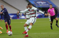 Portugal's Cristiano Ronaldo attempts a shot at goal during the UEFA Nations League soccer match between France and Portugal at the Stade de France in Saint-Denis, north of Paris, France, Sunday, Oct. 11, 2020. (AP Photo/Thibault Camus)